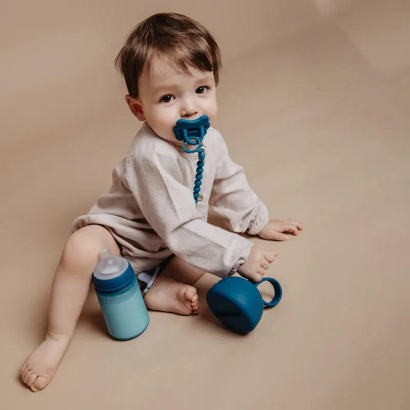 Suavinex Porte sucette en silicone avec poignée, +0 mois, Ballad Blue
